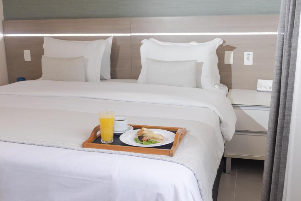 Postel nebo postele na pokoji v ubytování Hotel Adrianópolis All Suites