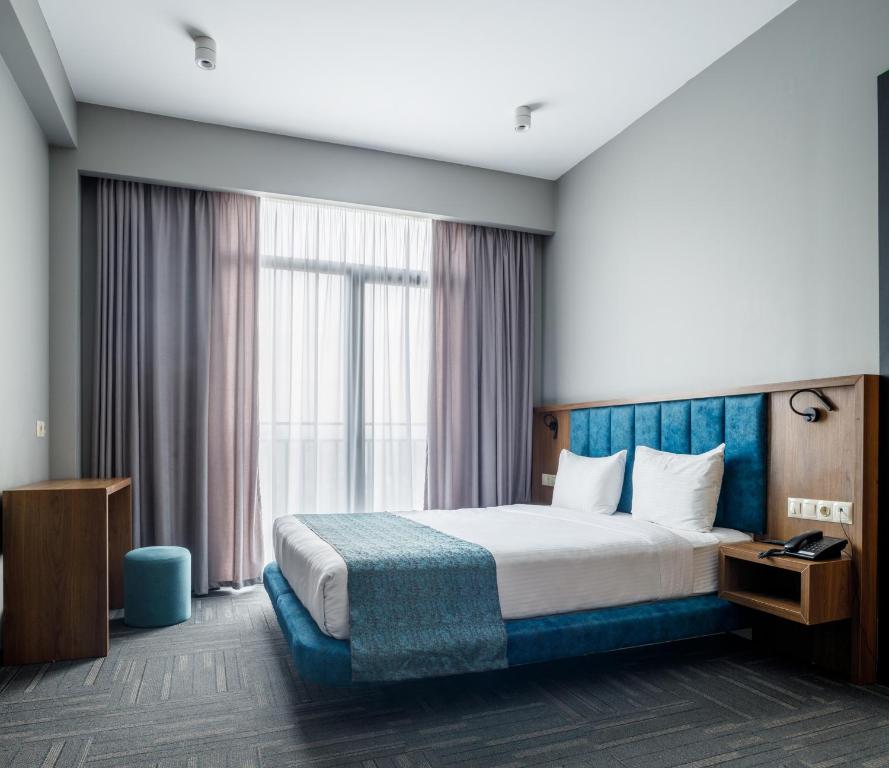 Postel nebo postele na pokoji v ubytování Address Inn