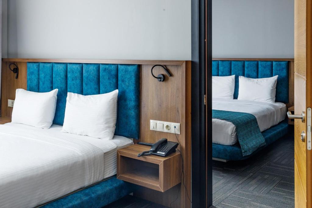 Postel nebo postele na pokoji v ubytování Address Inn