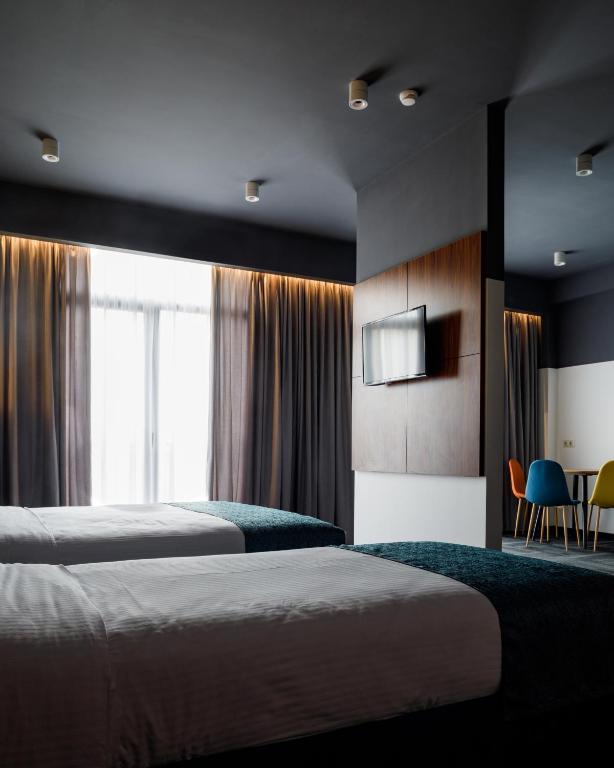 Postel nebo postele na pokoji v ubytování Address Inn