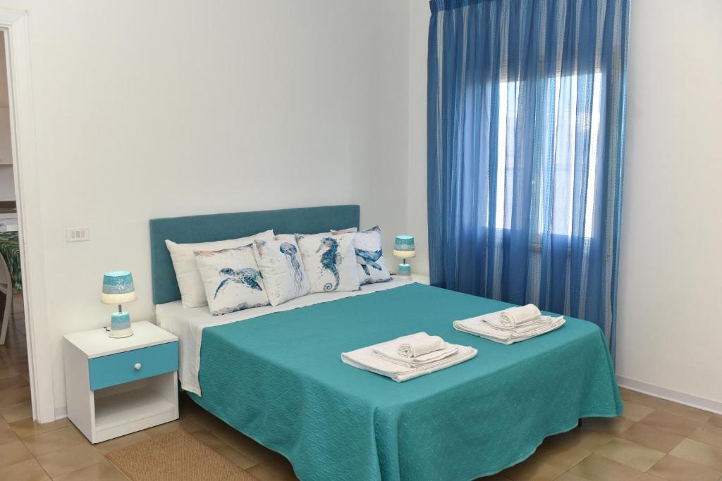 A bed or beds in a room at Giglio Selvatico Apartment