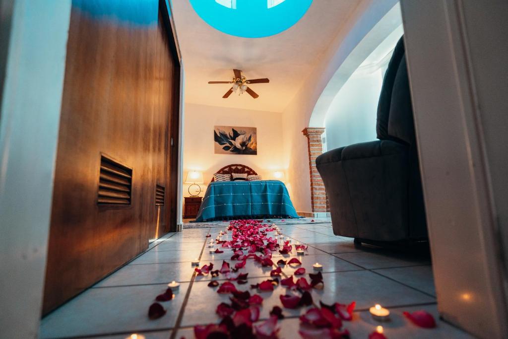 Postel nebo postele na pokoji v ubytování Boutique Hotel & Suites Hacienda Lord Twigg