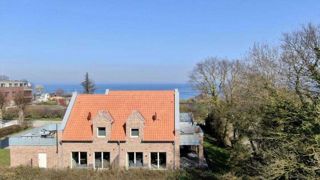 an aerial view of a house with an orange roof at Am Dahmer Leuchtturm 23f in Dahme