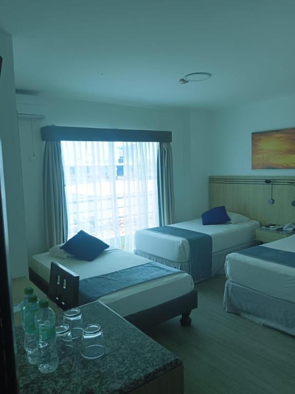 Postel nebo postele na pokoji v ubytování Hotel Mar Azul