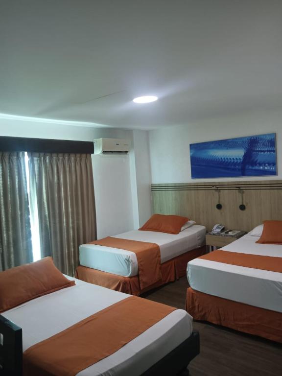 Postel nebo postele na pokoji v ubytování Hotel Mar Azul