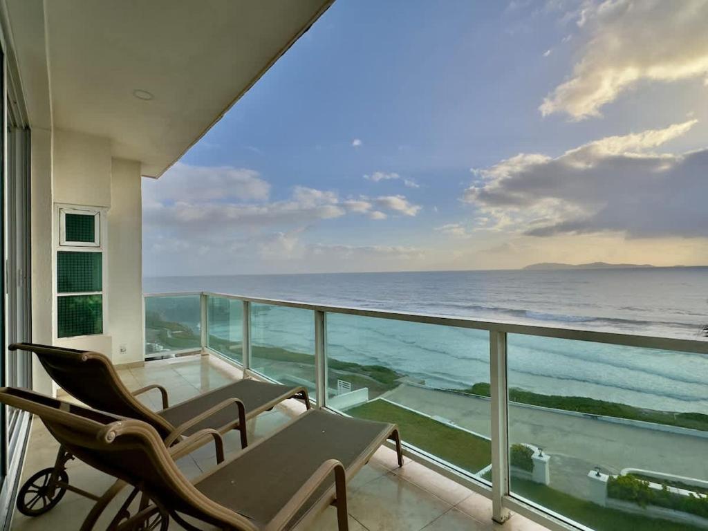 a balcony with a view of the ocean at Oceanfront Villa 4BR 4 BA Real Mediterraneo in Tijuana
