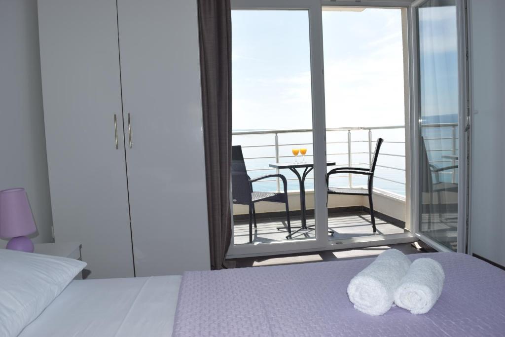 Posteľ alebo postele v izbe v ubytovaní Apartments King