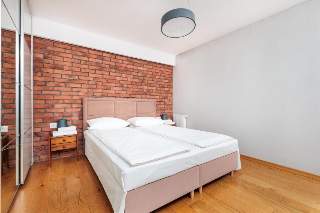 Posteľ alebo postele v izbe v ubytovaní Olimp Apartments
