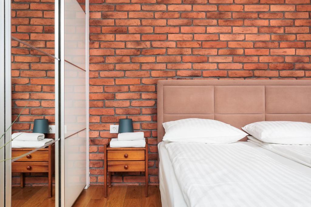 Posteľ alebo postele v izbe v ubytovaní Olimp Apartments