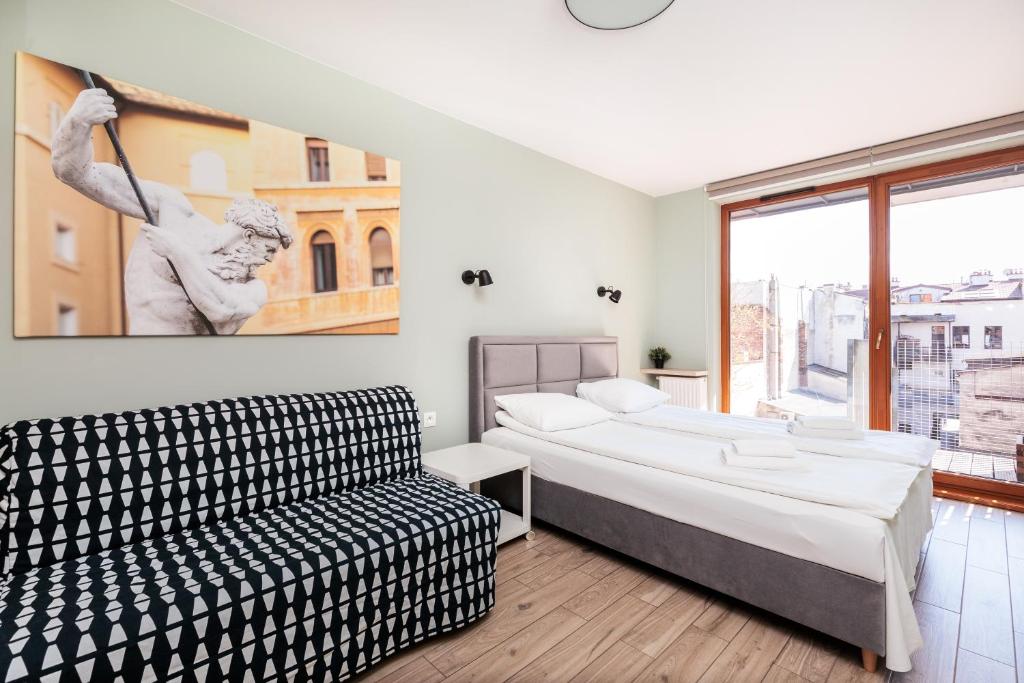 Posteľ alebo postele v izbe v ubytovaní Olimp Apartments