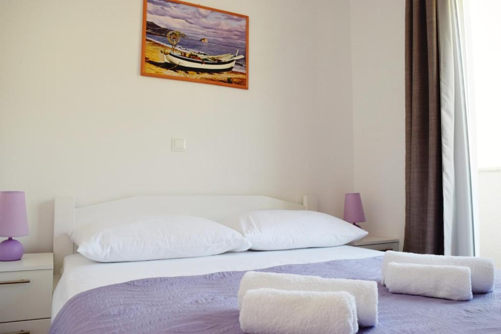 Posteľ alebo postele v izbe v ubytovaní Apartments King