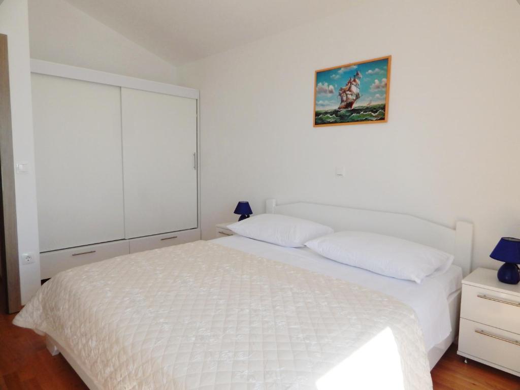 Posteľ alebo postele v izbe v ubytovaní Apartments King