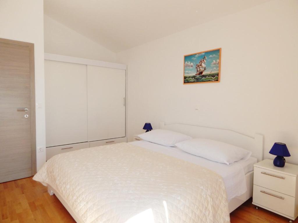 Posteľ alebo postele v izbe v ubytovaní Apartments King