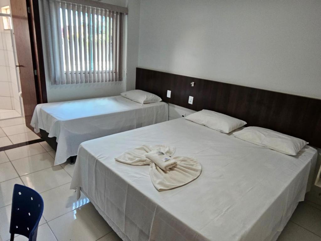 En eller flere senge i et værelse på Oriente Hotel