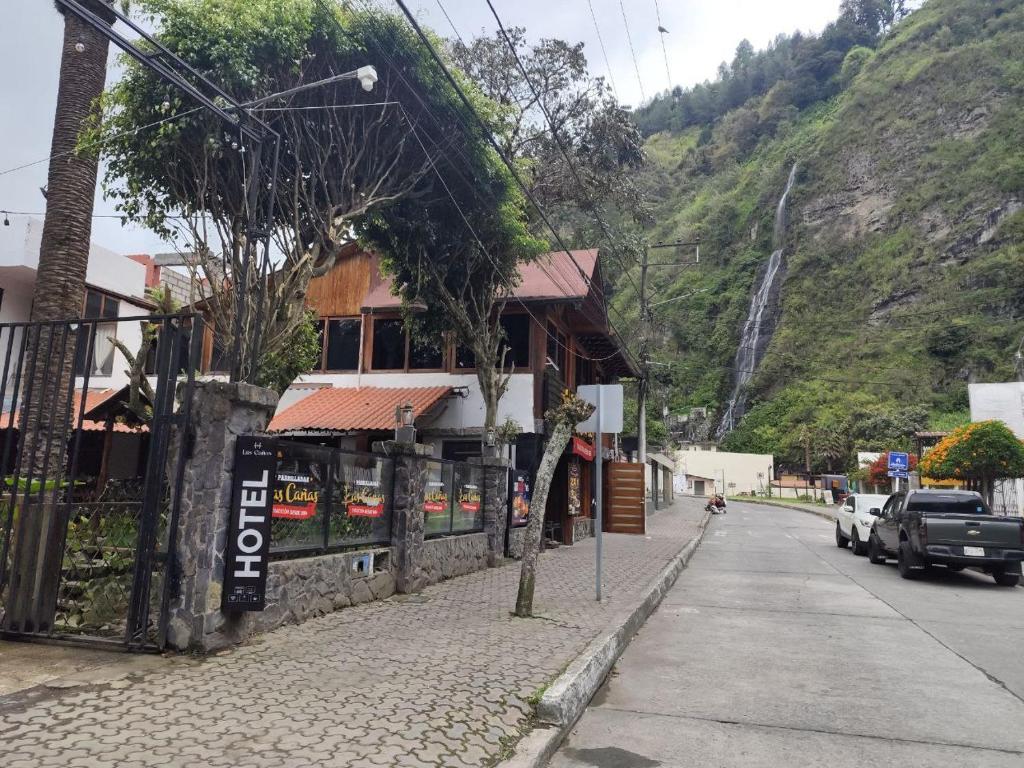 a building on the side of a street at Hotel Las Cañas in Baños