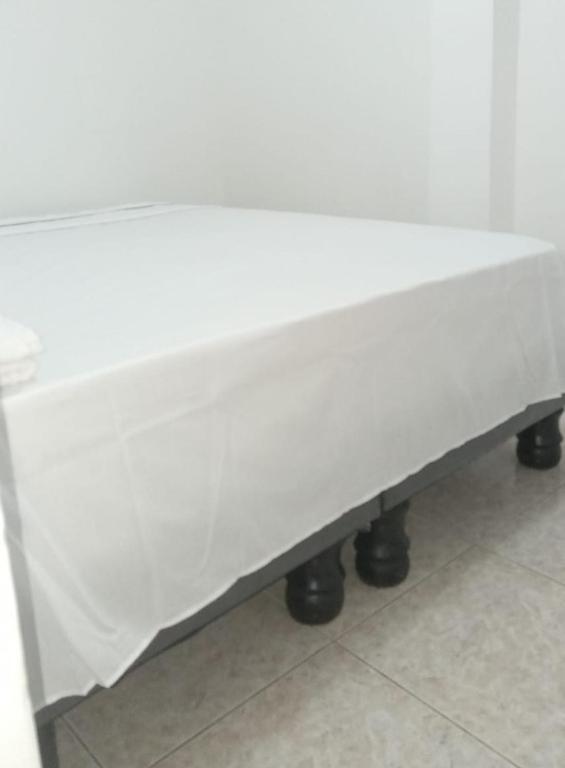 a white mattress sitting on a table in a room at Apartamentos Vacacionales in Manta
