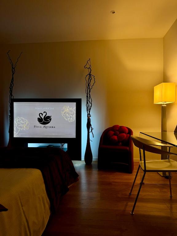 TV a/nebo společenská místnost v ubytování Villa Riviera Hotel Udine