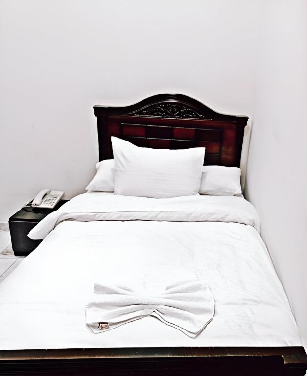 Postel nebo postele na pokoji v ubytování Cairo Crown Inn