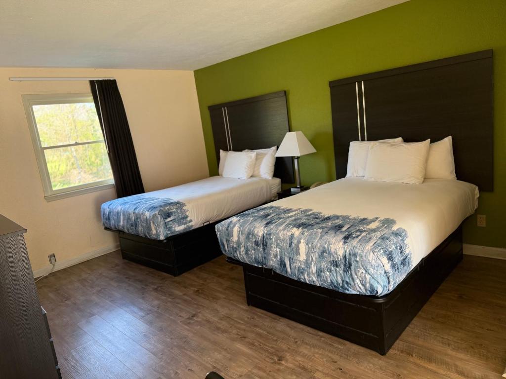 En eller flere senge i et værelse på Mountain Valley Inn