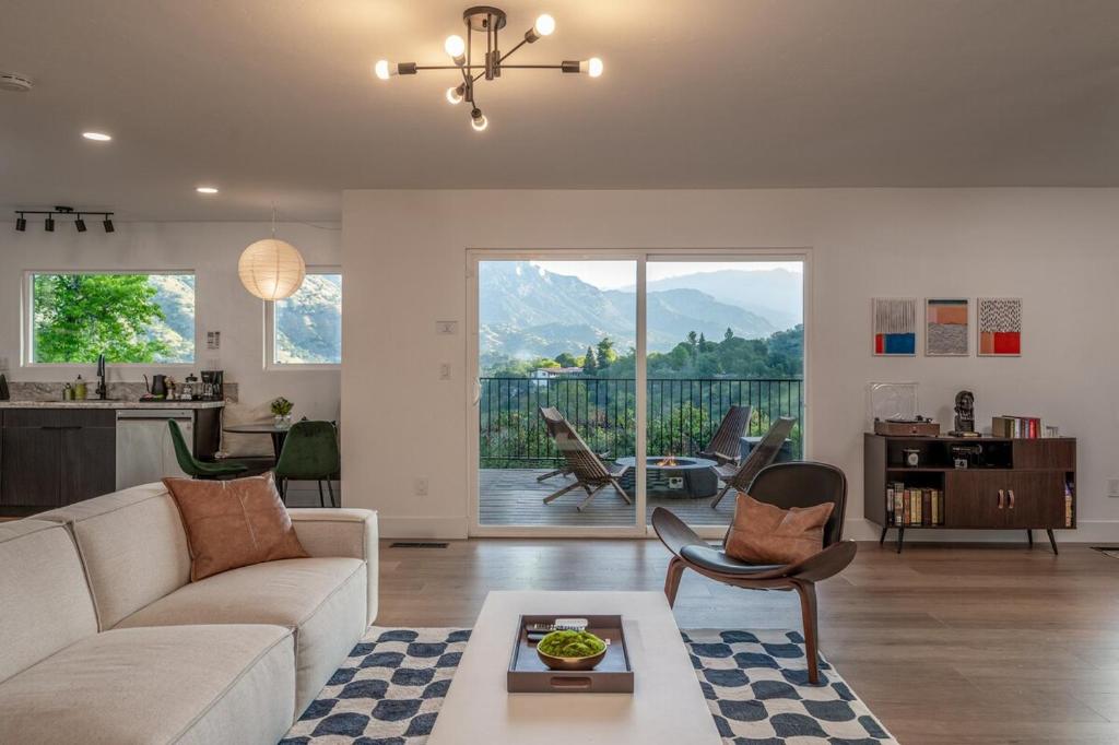 a living room with a couch and a table at Sequoia Retreat - Scenic Pool, Hot Tub, & Trails in Three Rivers