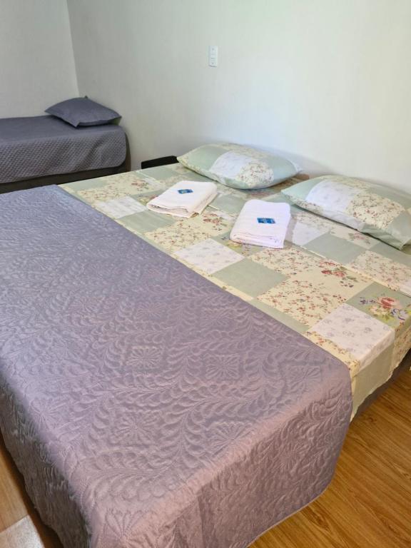 Postel nebo postele na pokoji v ubytování Sossego e Fé
