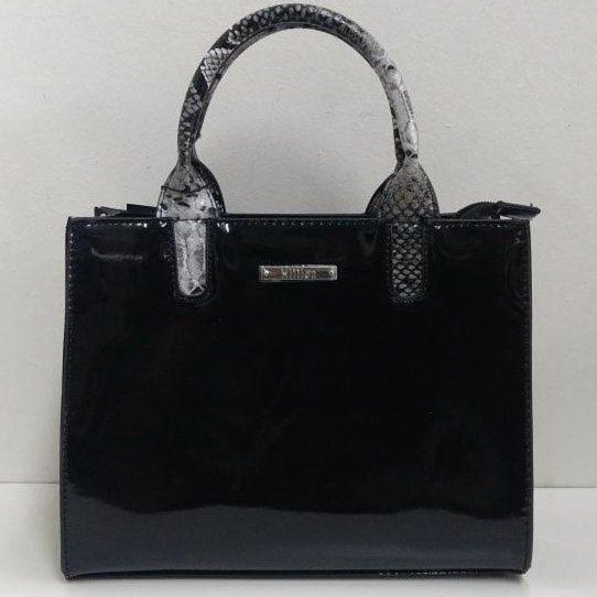a black bag with a handle on a white background at chalet vistas in Villa Ventana