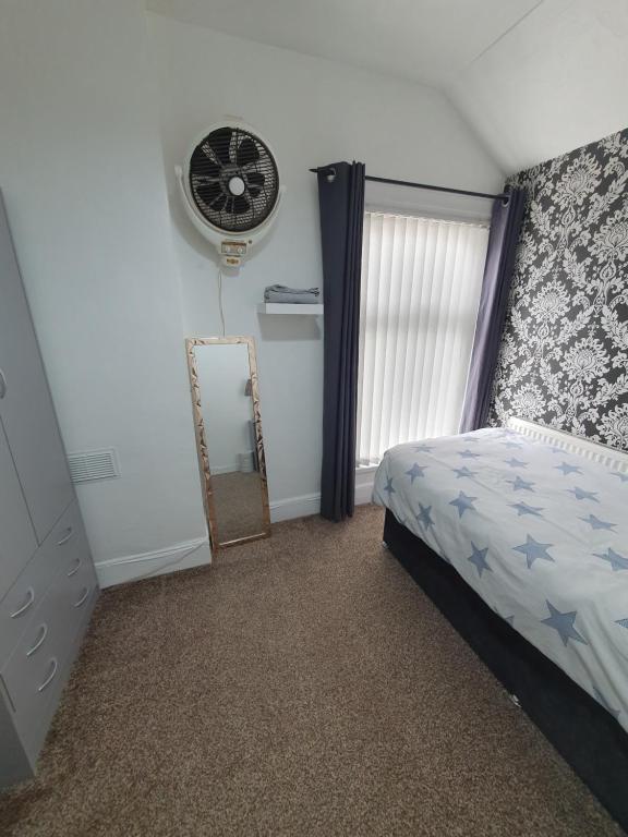 Ένα ή περισσότερα κρεβάτια σε δωμάτιο στο Private Room In Cardiff