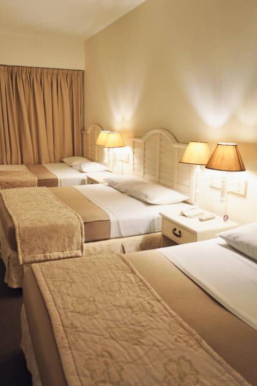 Postel nebo postele na pokoji v ubytování Hotel Roraima Inn