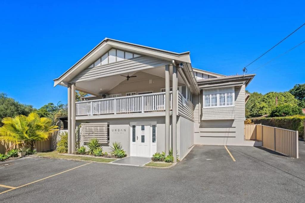 a large house with a garage at 5 Bed 5 Bath Urban Getaway Ipswich Central in Ipswich