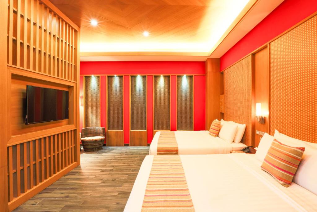 Postel nebo postele na pokoji v ubytování 日出溫泉飯店Sunrise Hot Spring Hotel