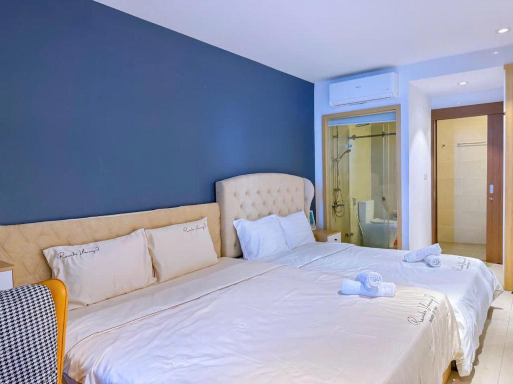 Postel nebo postele na pokoji v ubytování Condotel CSJ Luxury Vũng Tàu