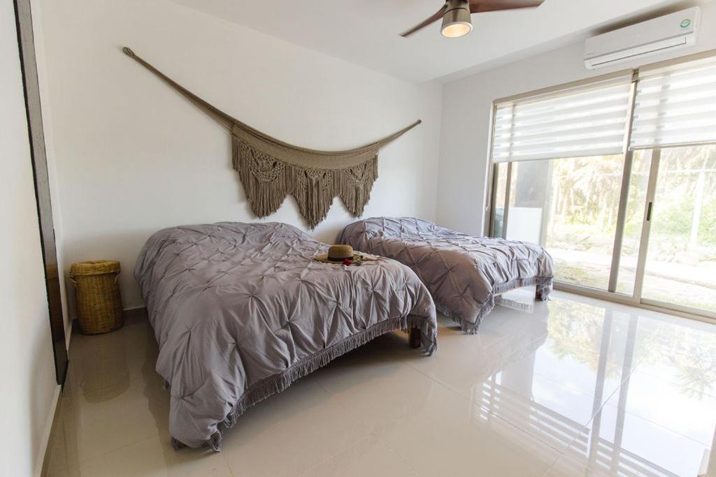 Angelina 28 Beachfront and Family Apartments - Modern and Relaxing Long Stays - 20 min from Cancun Airport - Appartement Met 1 Slaapkamer En Tuin