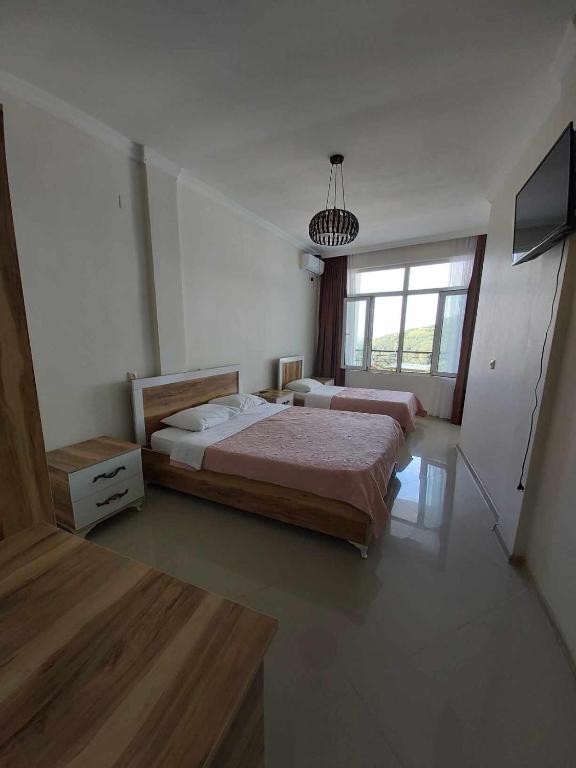 Postel nebo postele na pokoji v ubytování Goga Guest House