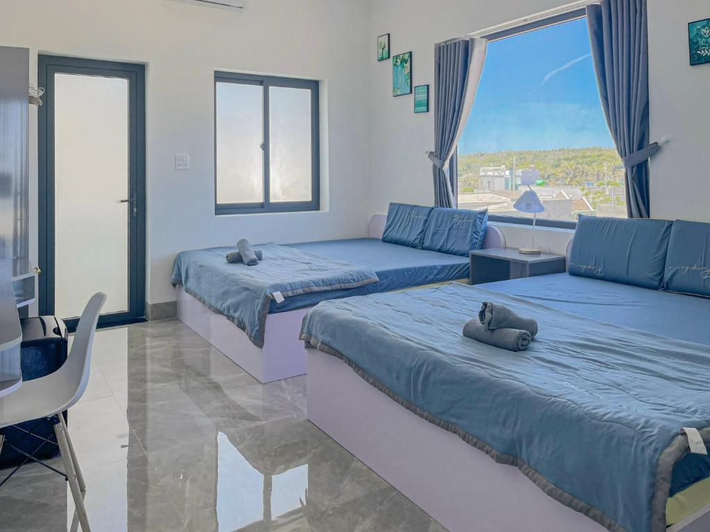 Ένα ή περισσότερα κρεβάτια σε δωμάτιο στο Homestay Bình Râu