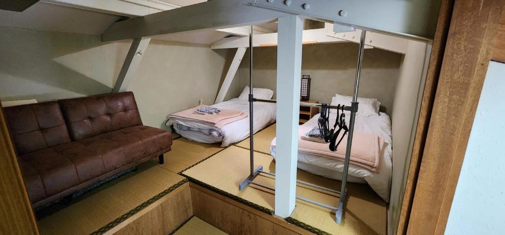 Postel nebo postele na pokoji v ubytování Myoko Ski Lodge in Akakura Village
