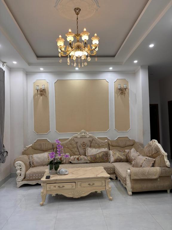 a living room with a couch and a coffee table at lizhome in Da Nang