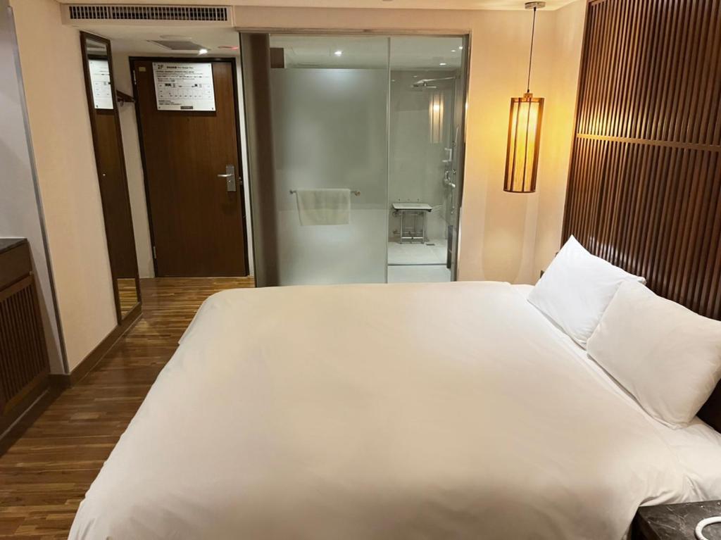 Postel nebo postele na pokoji v ubytování Guide Hotel Taipei Bade