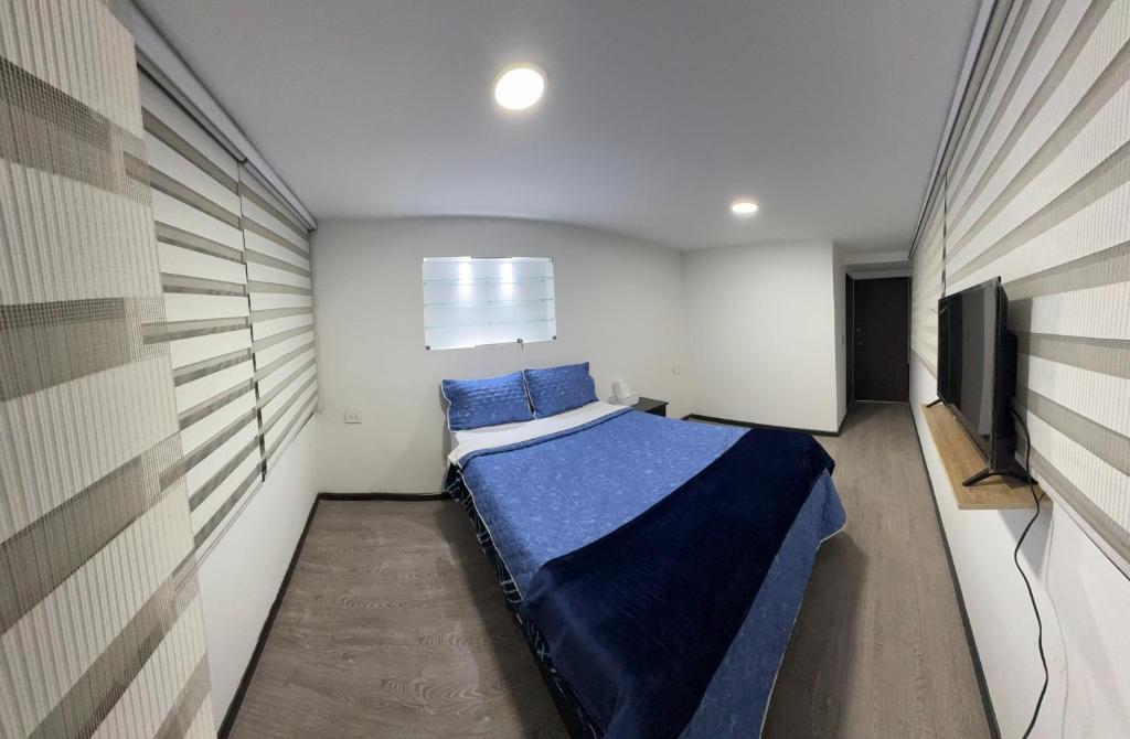 Postel nebo postele na pokoji v ubytování Hotel Dorado - Cerca al Aeropuerto - Habitación 401