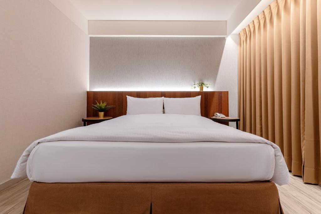 Postel nebo postele na pokoji v ubytování Guide Hotel Taipei Fuxing North