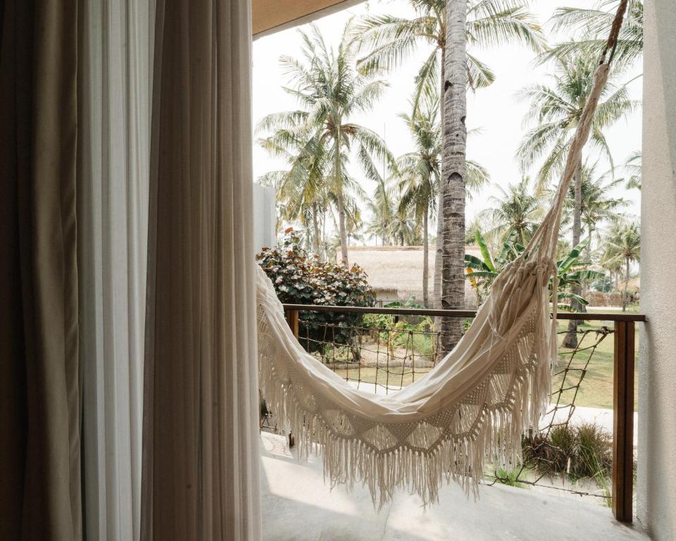 Un balcón o terraza de Hotel Lumi Gili Trawangan