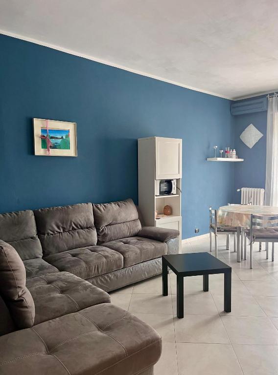a living room with a couch and a table at Casa Irene in Nichelino