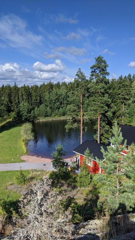 an aerial view of a house next to a lake at Villa Korpikallio in Naantali
