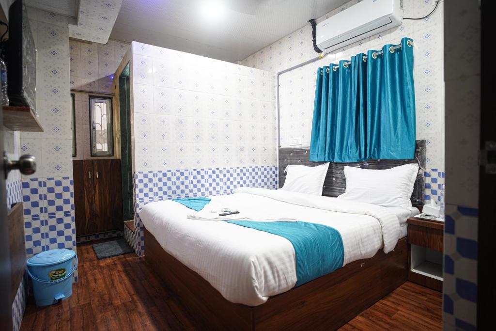 Ένα ή περισσότερα κρεβάτια σε δωμάτιο στο Nexus Corporate Stay