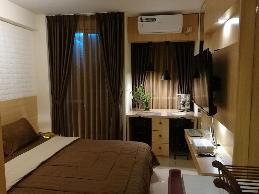 Una cama o camas en una habitación de Serenity Luxe Callia Residence