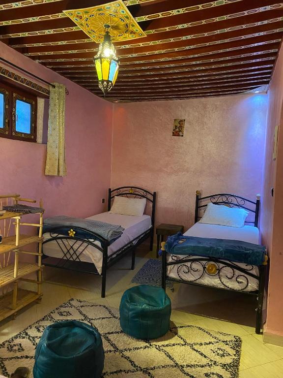 Postel nebo postele na pokoji v ubytování Downtown Hostel