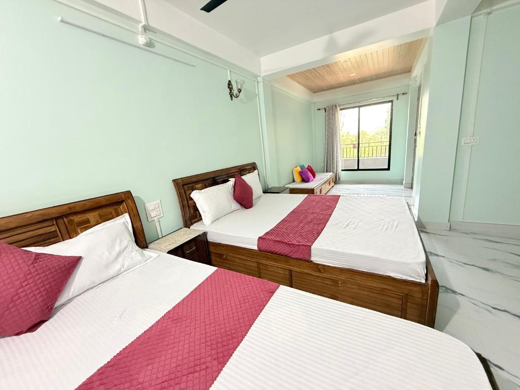 Postel nebo postele na pokoji v ubytování Maple Homestay