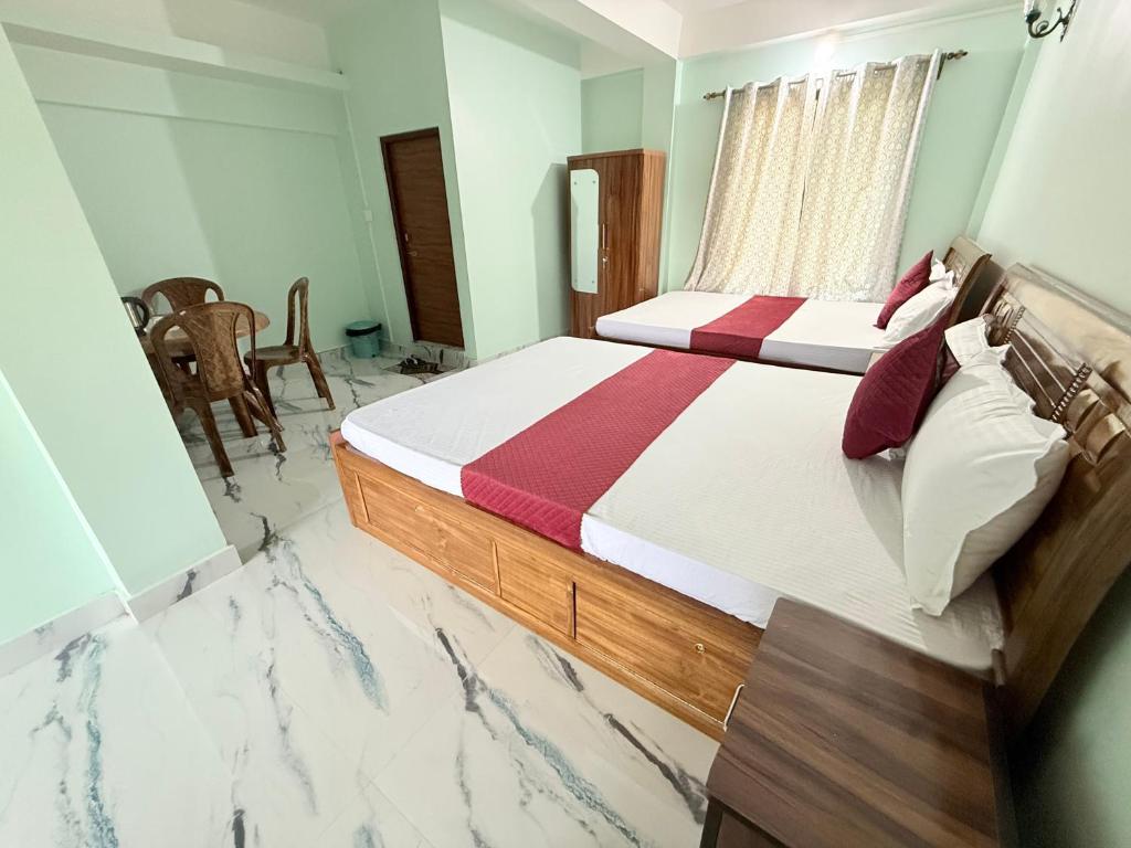 Postel nebo postele na pokoji v ubytování Maple Homestay