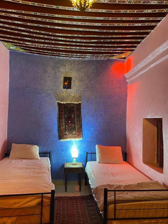 Postel nebo postele na pokoji v ubytování Downtown Hostel