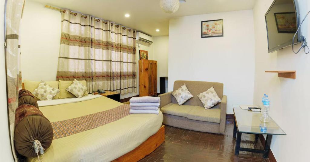 Postel nebo postele na pokoji v ubytování Hotel Shree Tara