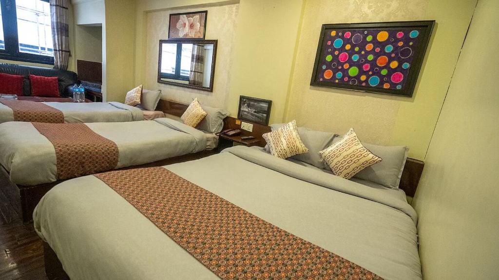 Postel nebo postele na pokoji v ubytování Hotel Shree Tara